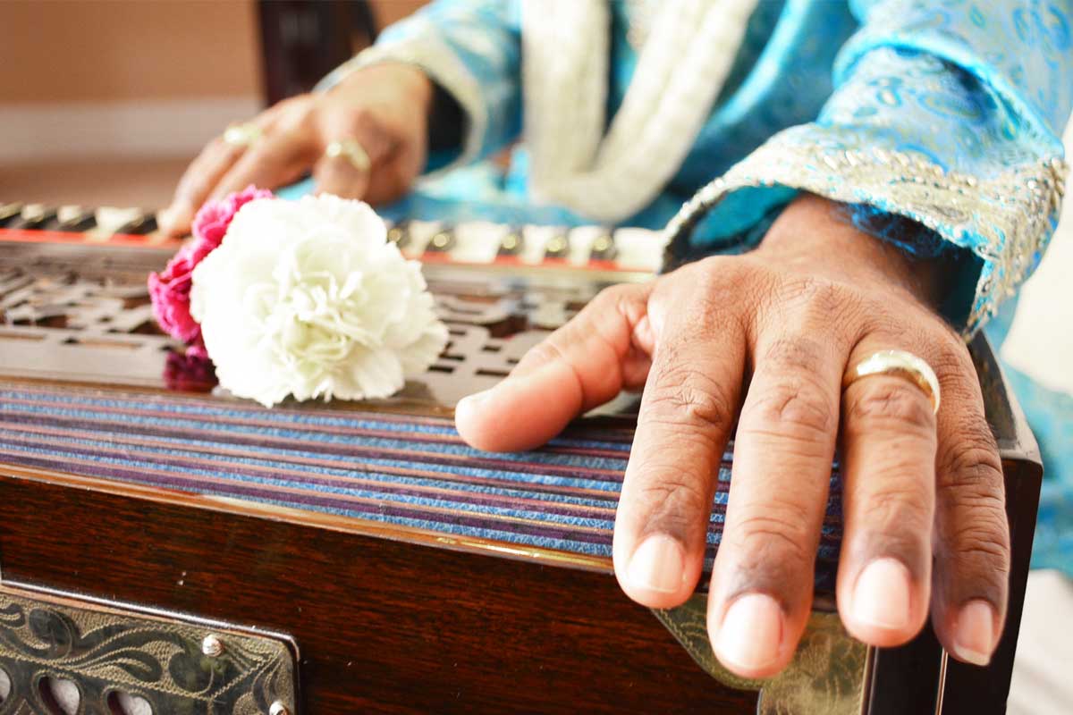 Guruji Dev Bansraj Ramkissoon and Harmonium